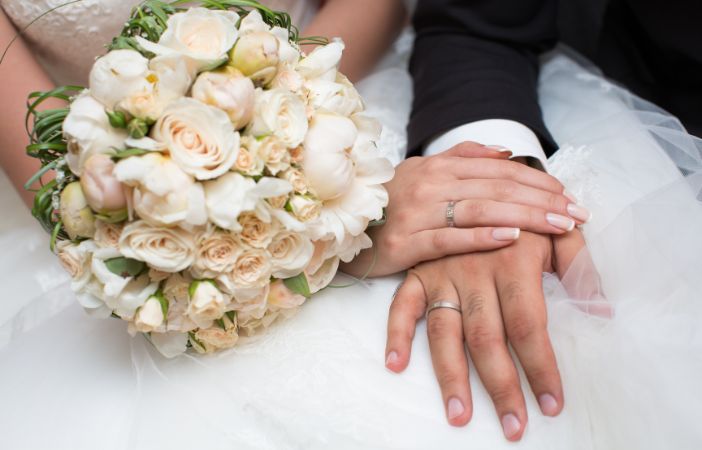 Image of bride and groom close up of flowers